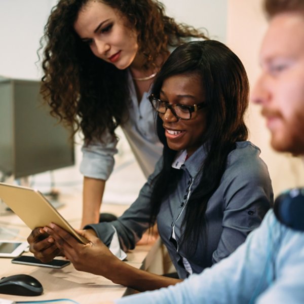 Programmers cooperating at  IT company developing apps